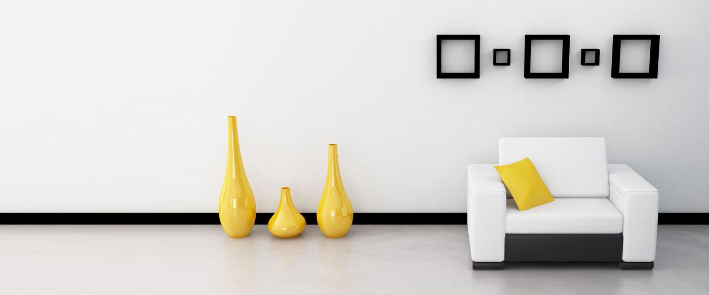 Minimal white room with three yellow vases and small picture frames